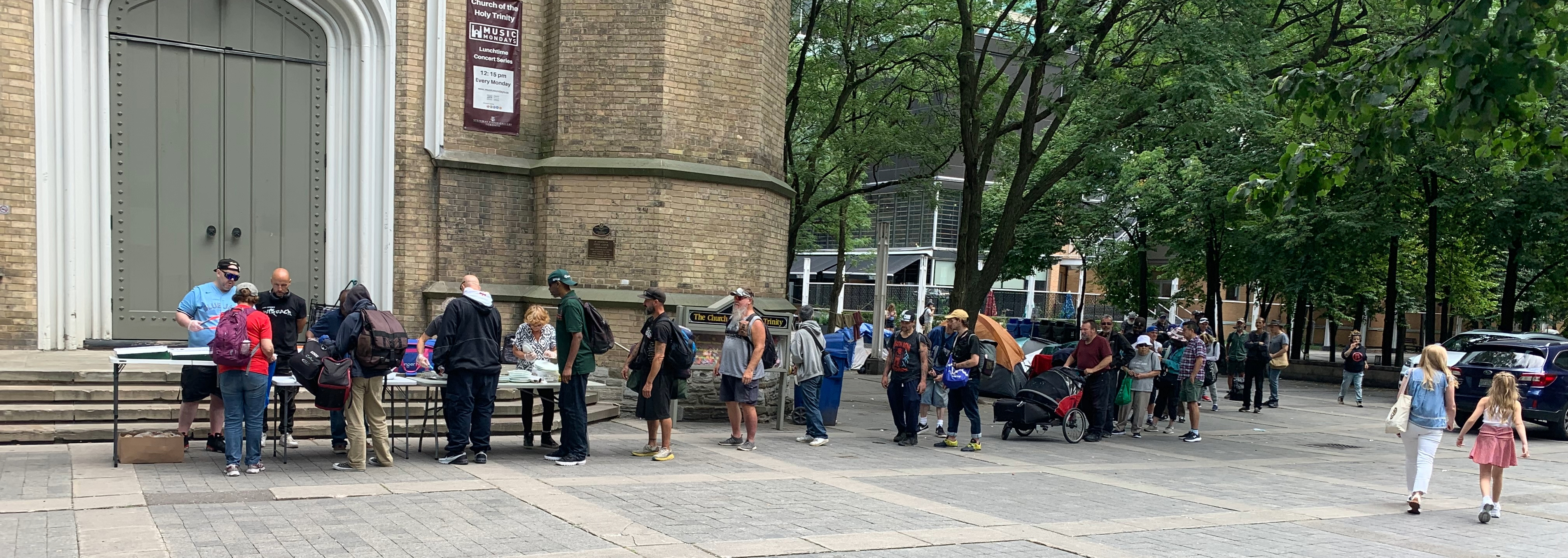 Volunteers serving hot food in downtown Toronto